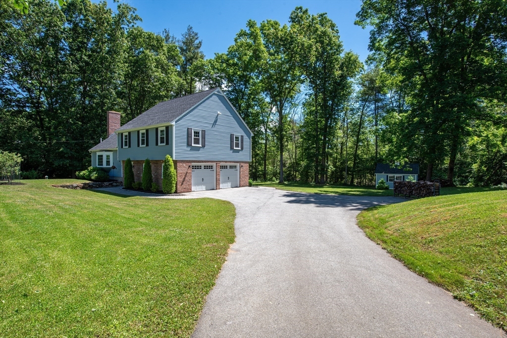 41 Woodcrest Road Boxford, MA 01921 - Photo 25 of 31 a front view of a house with yard and green space