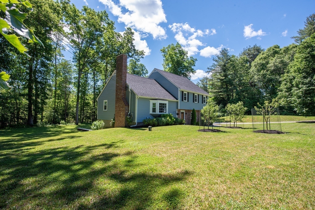 41 Woodcrest Road Boxford, MA 01921 - Photo 26 of 31 a house with swimming pool in front of it