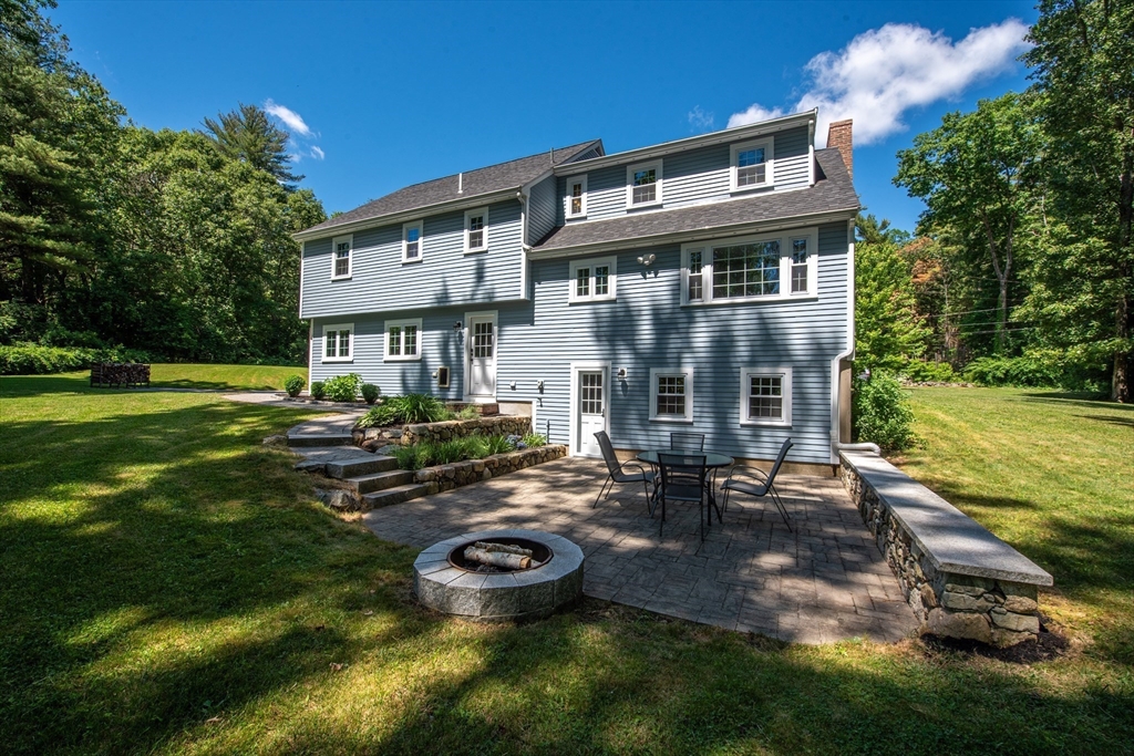 41 Woodcrest Road Boxford, MA 01921 - Photo 27 of 31 a front view of a house with swimming pool and garden