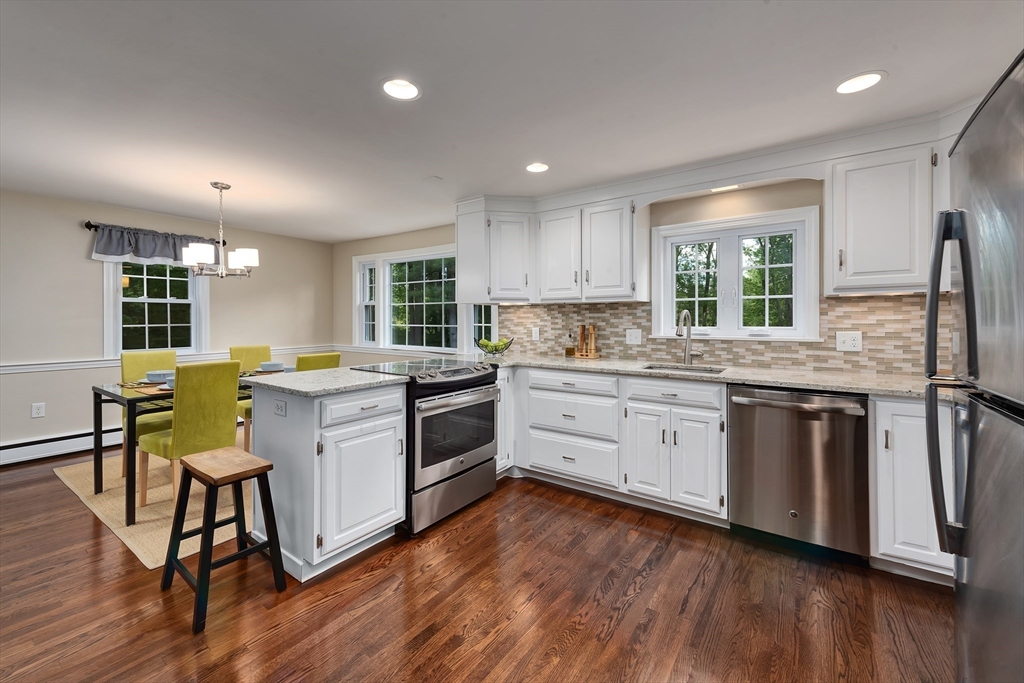 41 Woodcrest Road Boxford, MA 01921 - Photo 4 of 31 a kitchen with a sink window and stainless steel appliances