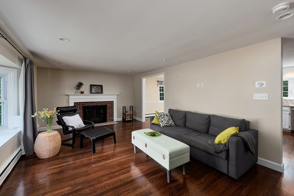 41 Woodcrest Road Boxford, MA 01921 - Photo 8 of 31 a living room with furniture a fireplace and wooden floor