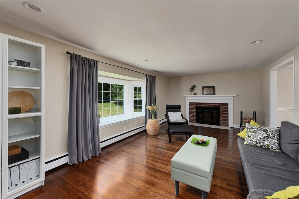 41 Woodcrest Road Boxford, MA 01921 - Photo 9 of 31 a living room with furniture and a fireplace