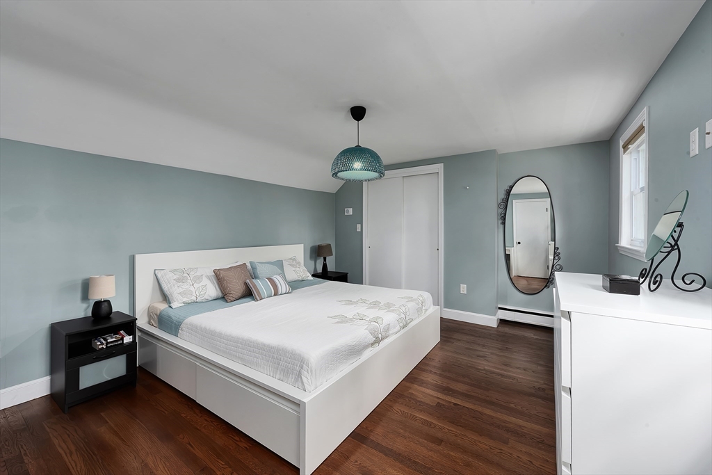 41 Woodcrest Road Boxford, MA 01921 - Photo 10 of 31 a bedroom with a bed and a dresser with wooden floor