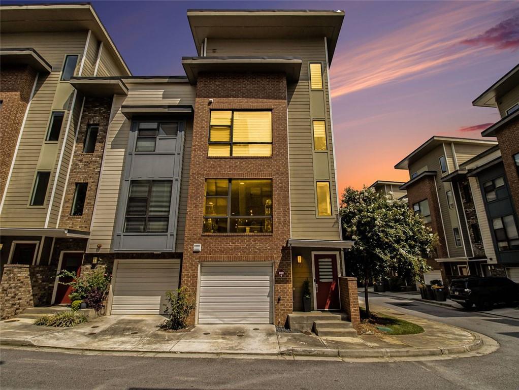a view of a brick building with many windows