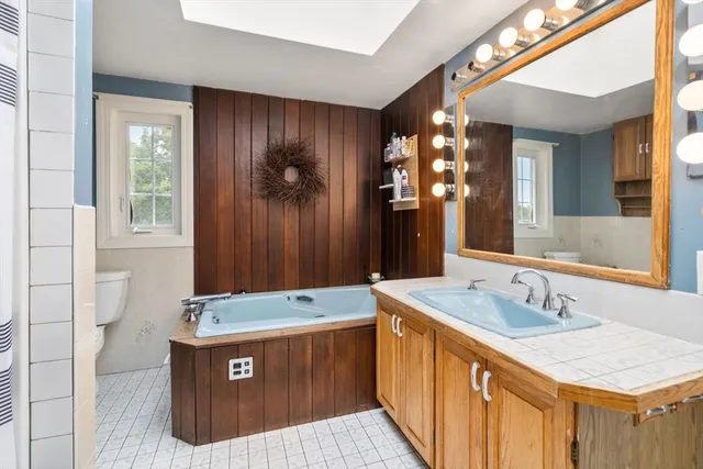 a bathroom with a sink double vanity and a shower