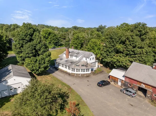an aerial view of a house with yard
