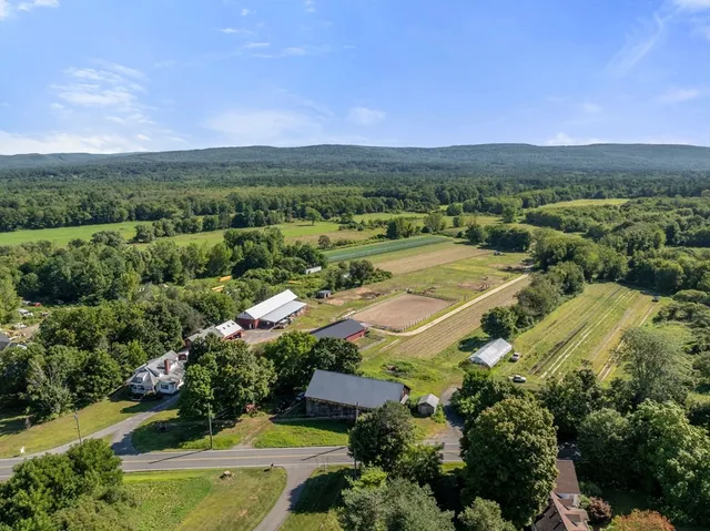 an aerial view of a city with mountains