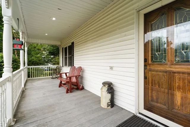a view of a porch with furniture