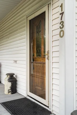a view of a door and a window