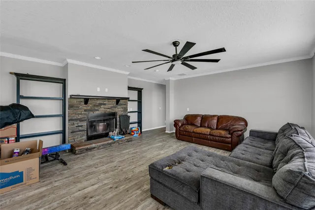 a living room with furniture and a fireplace