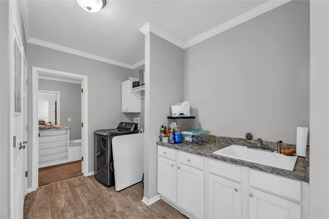a kitchen with a sink and cabinets