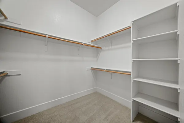 a view of an empty walk in closet