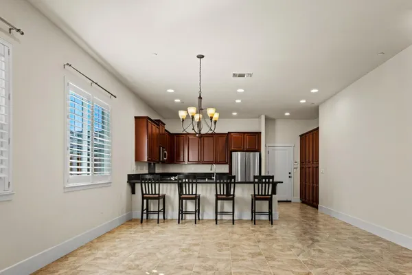 a view of a kitchen with microwave and cabinets