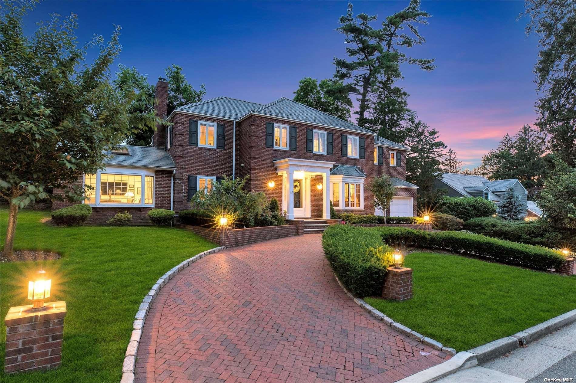 a front view of a house with a yard table and chairs