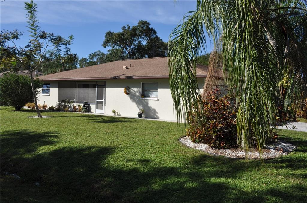 771 Tanager Road Venice, FL 34293 - Photo 1 of 1 a front view of a house with a garden