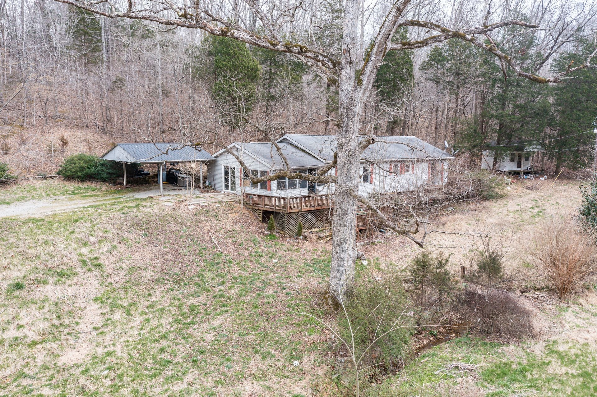 2434 Greenbriar Road Waverly, TN 37185 - Photo 1 of 21 a view of a town with brick house and large trees
