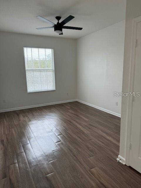 13584 Turtle Marsh Loop, Unit 132 Orlando, FL 32837 - Photo 12 of 21 wooden floor in an empty room with a window