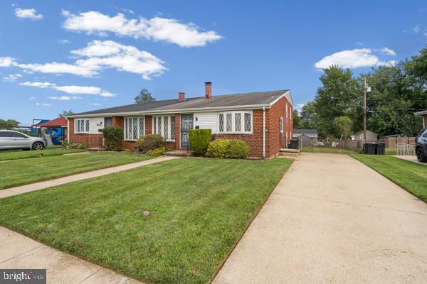 3413 Retlaw Road Baltimore, MD 21207 - Photo 3 of 32 Charming brick home with lush lawn.