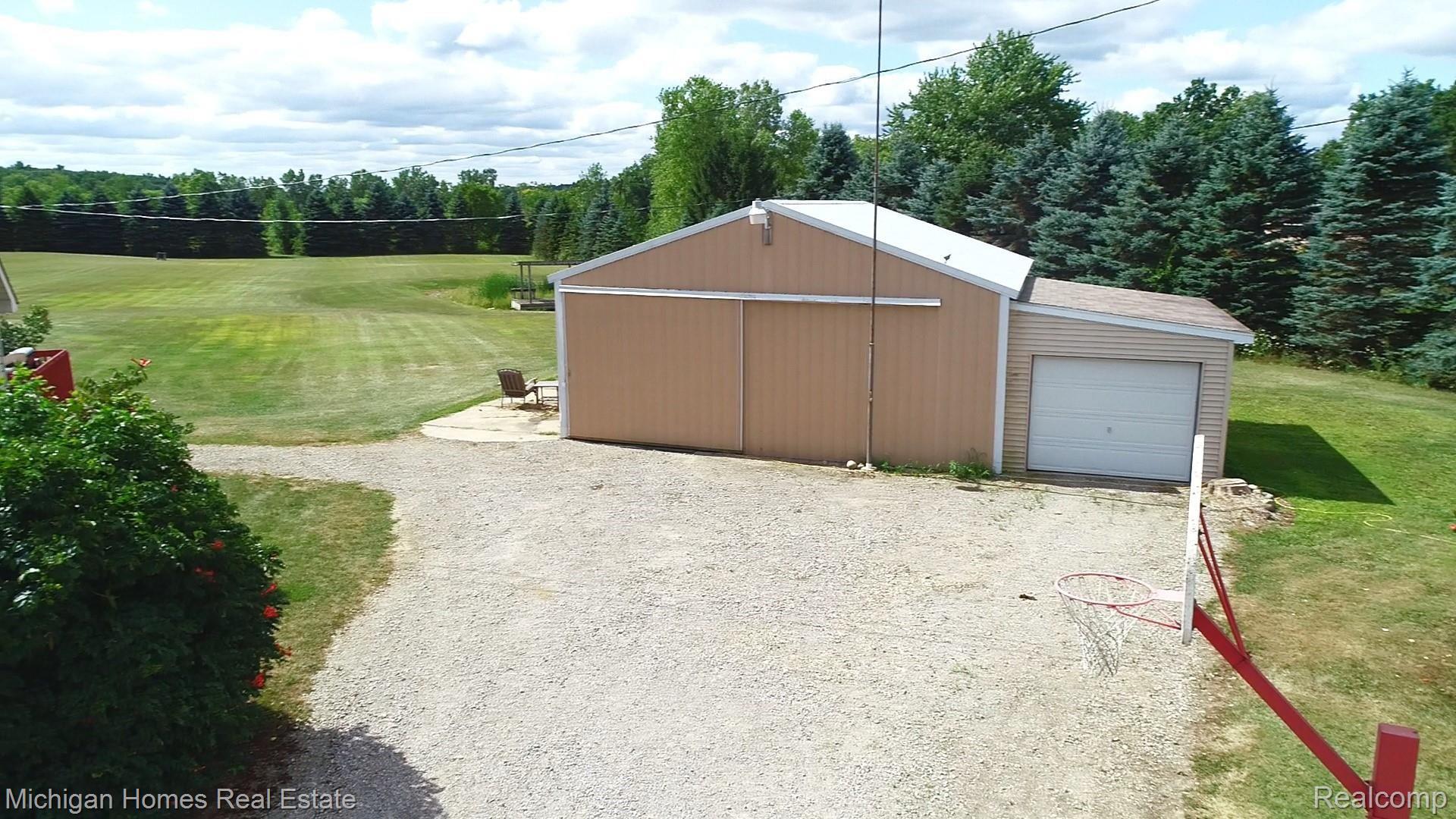 ENORMOUS POLE BARN WITH LEAN TO FOR EXTRA PARKING!  YOU CAN FIT 2-3 CARS INSIDE OF THE POLE BARN!  THE POSSIBILITIES ARE ENDLESS