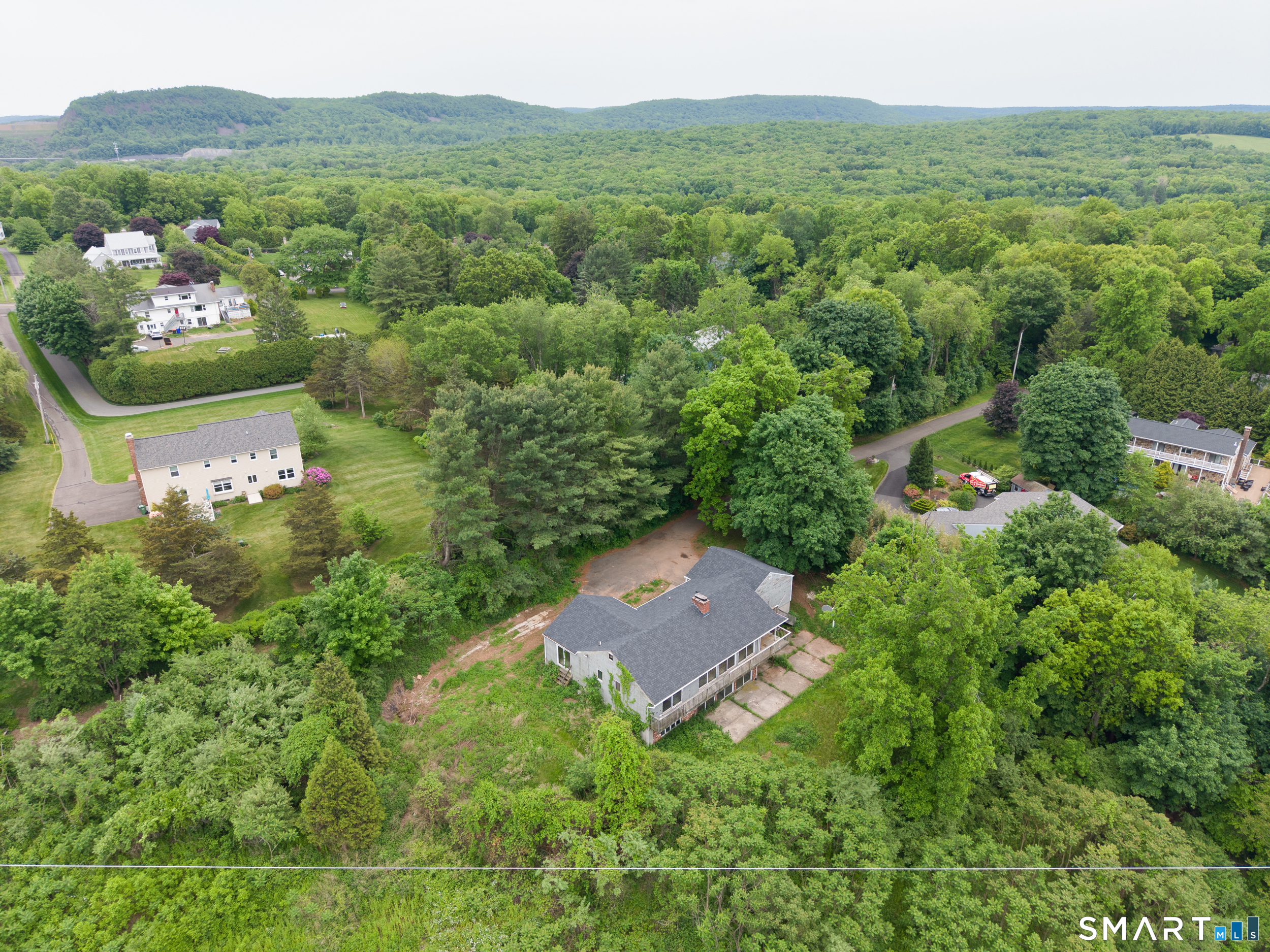63 High Hill Road Wallingford, CT 06492 - Photo 33 of 34 an aerial view of a house with a yard