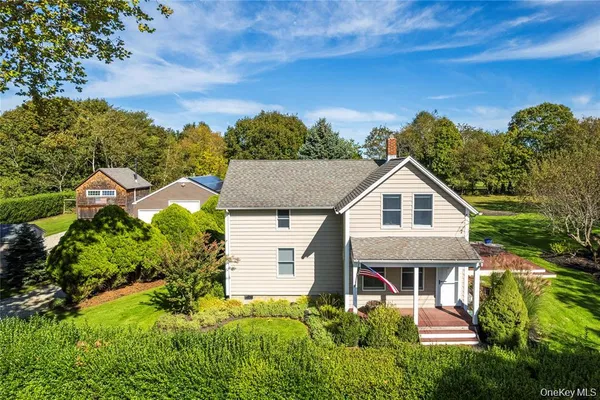 a aerial view of a house with a yard