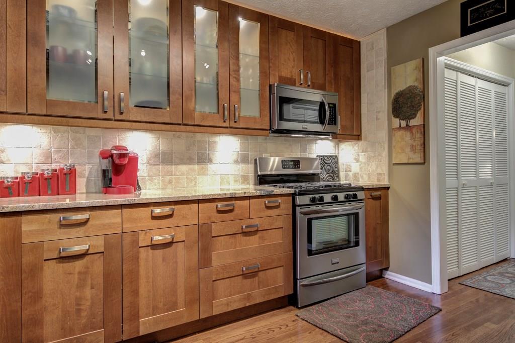 2947 Lavista Way, Unit 2947 Decatur, GA 30033 - Photo 1 of 1 Modern cabinets with soft-close drawers, beautiful granite counters, tumbled stone back splash, under-cabinet lighting, matching stainless steel appliances and an extra large sink are some of the features of this totally new kitchen.
