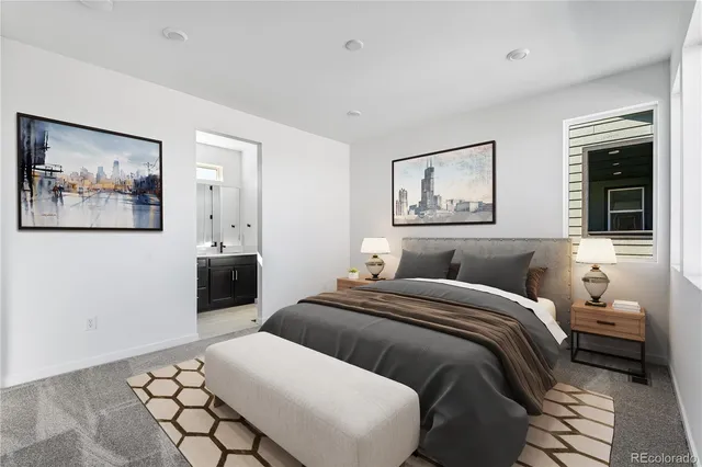 a bedroom with a bed and a painting on the wall