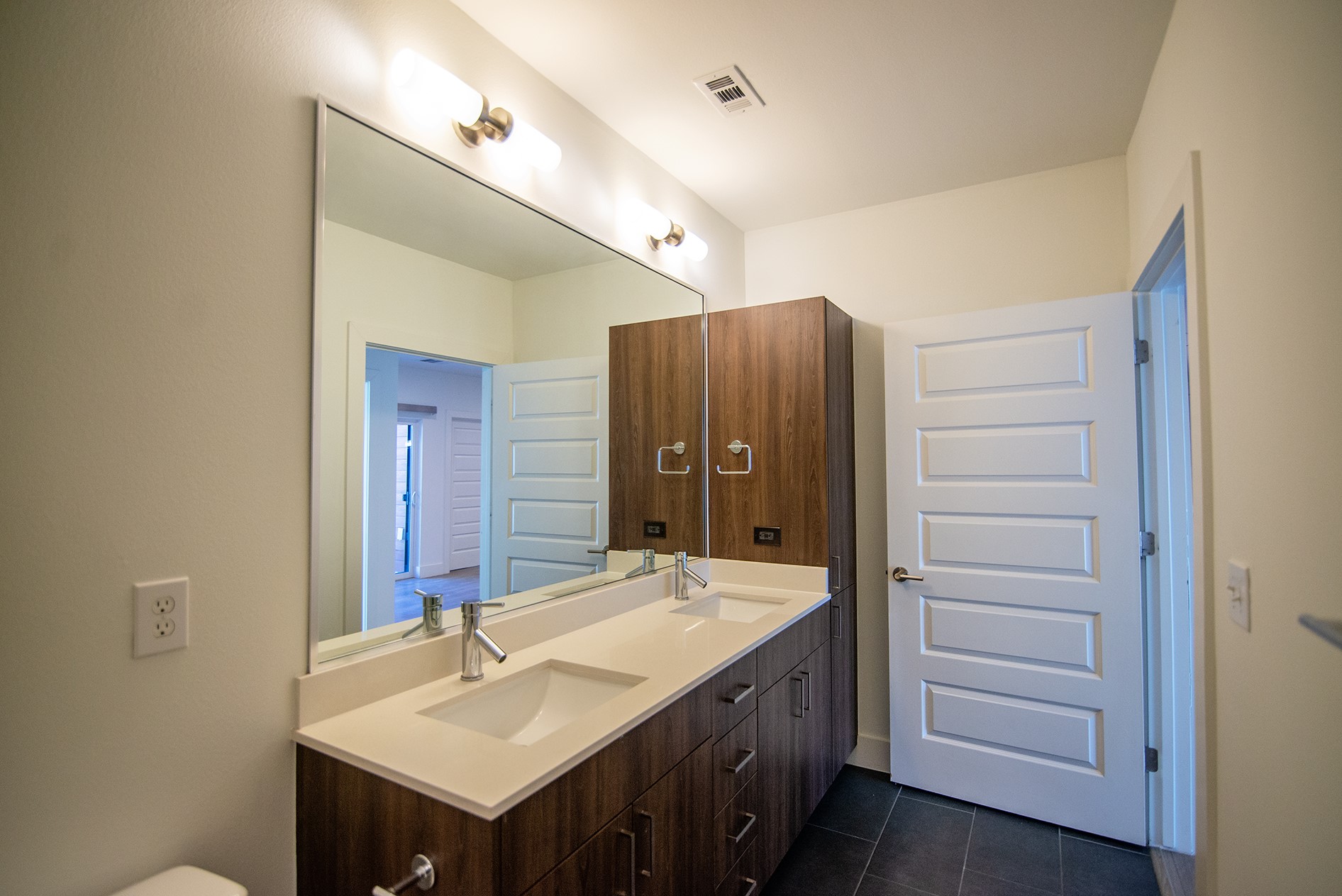 2213 Poquito Street, Unit 313 Austin, TX 78722 - Photo 13 of 26 a bathroom with a sink and a mirror
