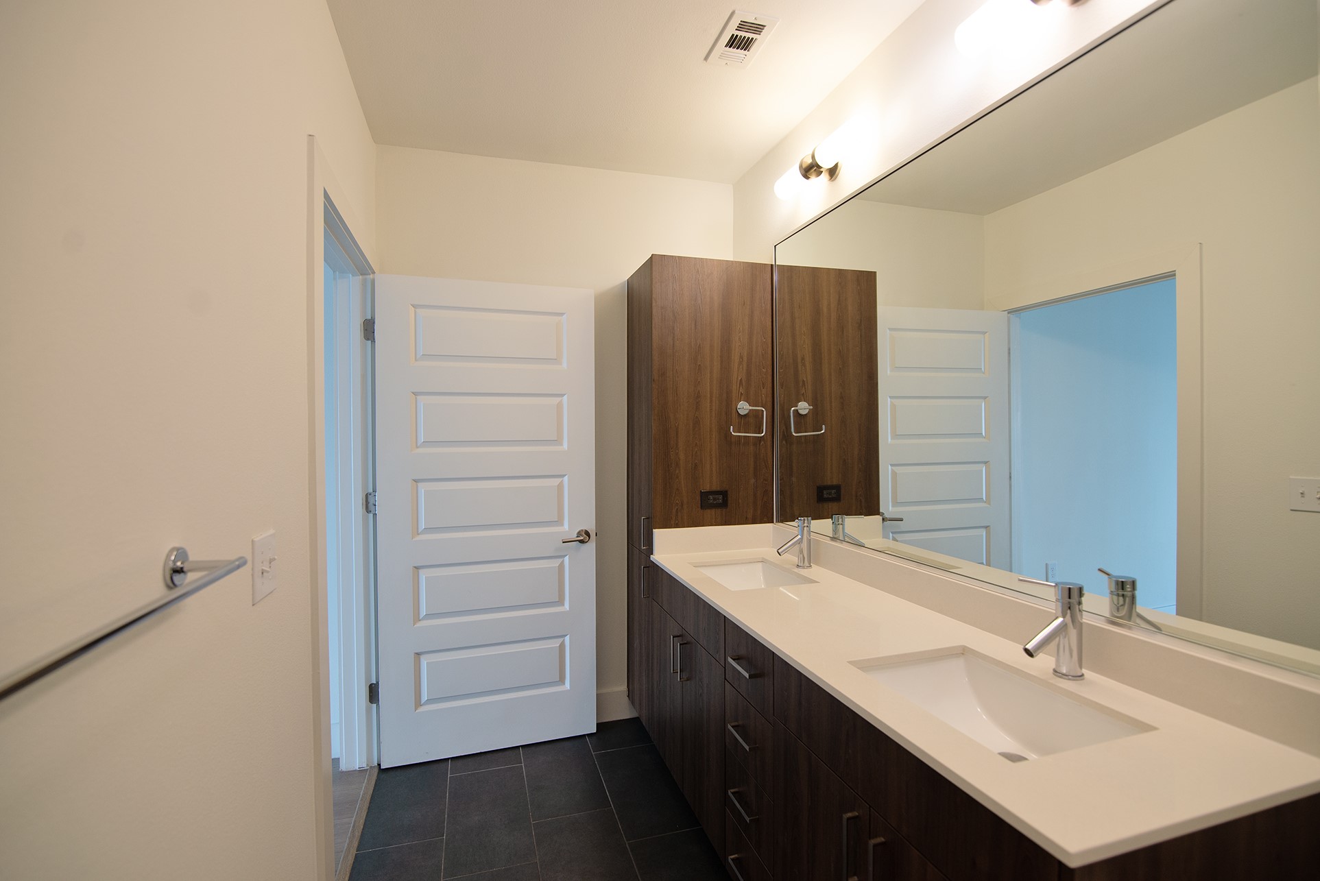 2213 Poquito Street, Unit 313 Austin, TX 78722 - Photo 17 of 26 a bathroom with a sink and mirror