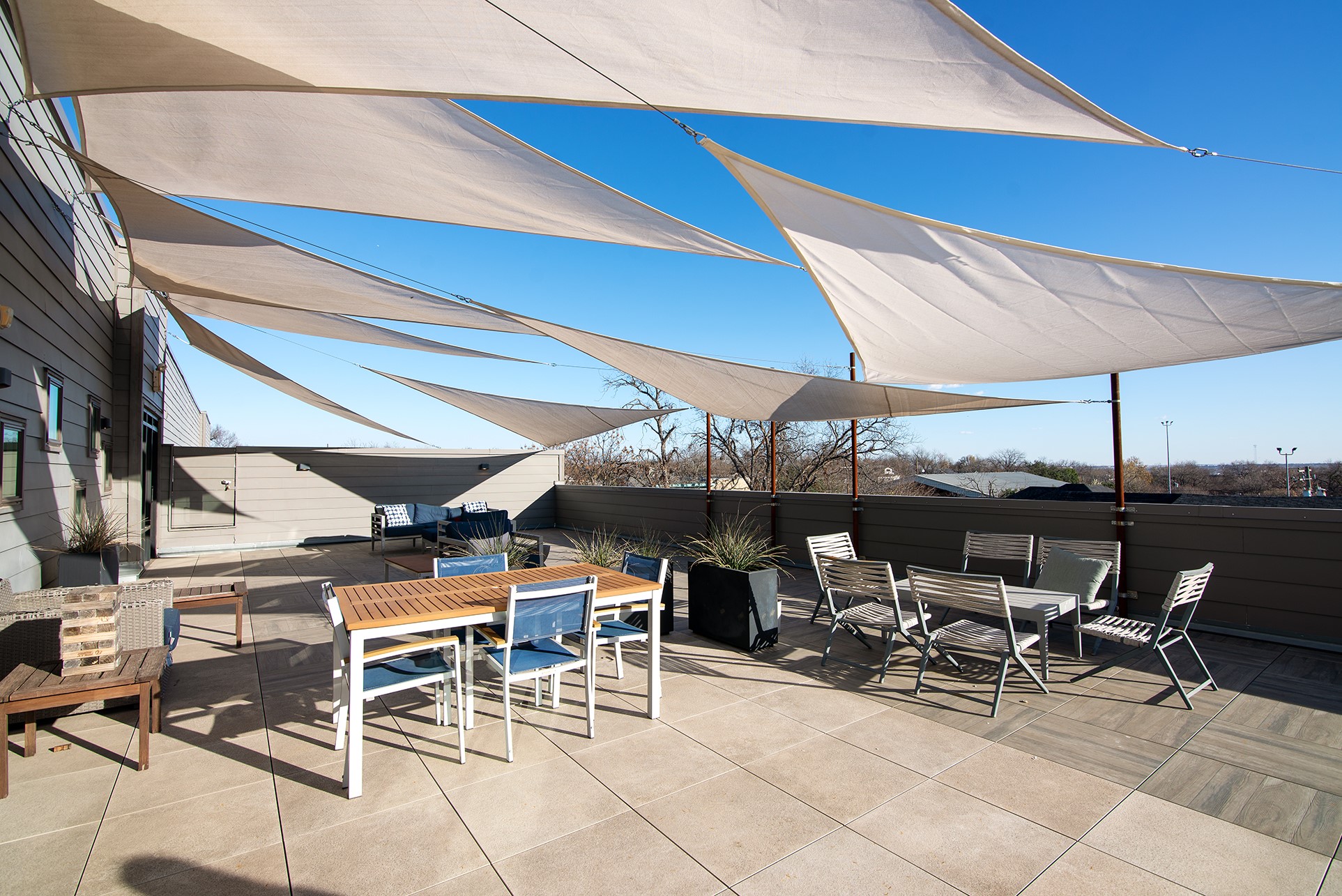 2213 Poquito Street, Unit 313 Austin, TX 78722 - Photo 24 of 26 a view of a patio with table and chairs