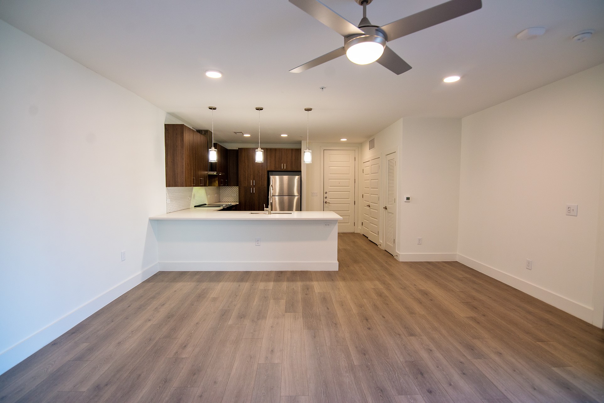 2213 Poquito Street, Unit 313 Austin, TX 78722 - Photo 9 of 26 a view of kitchen with sink and wooden floor