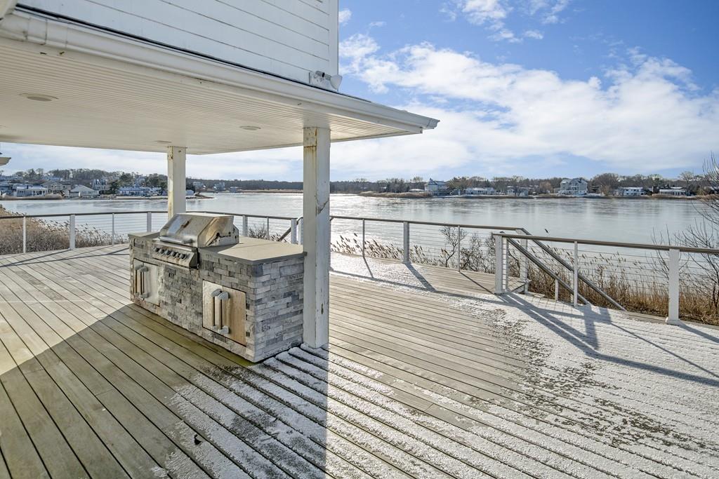 62 Surfside Road Scituate, MA 02066 - Photo 7 of 19 a view of a balcony with wooden floor and outdoor seating