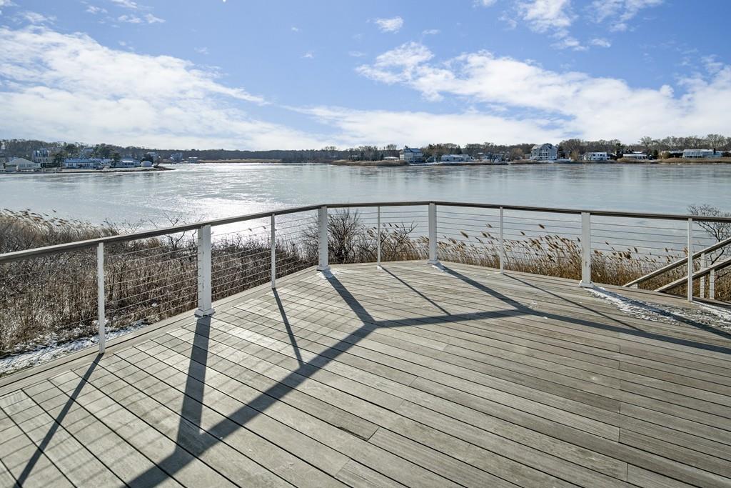 62 Surfside Road Scituate, MA 02066 - Photo 8 of 19 a view of swimming pool with lake and houses in the back