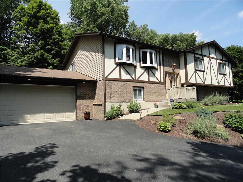 Oversized split entry on just over an acre with lots of updates.