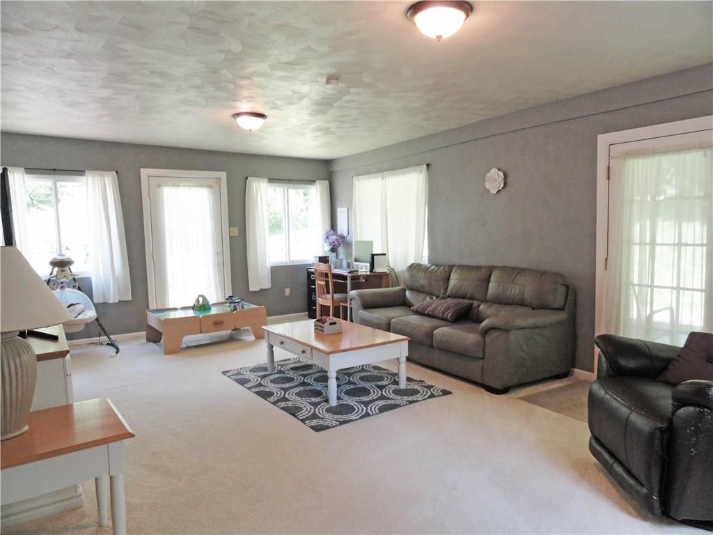 2339 Spicher Hill Road Irwin, PA 15642 - Photo 11 of 25 Light and bright first floor family room opens to back patio and huge back yard. Need more space? Finish the huge 35' basement.