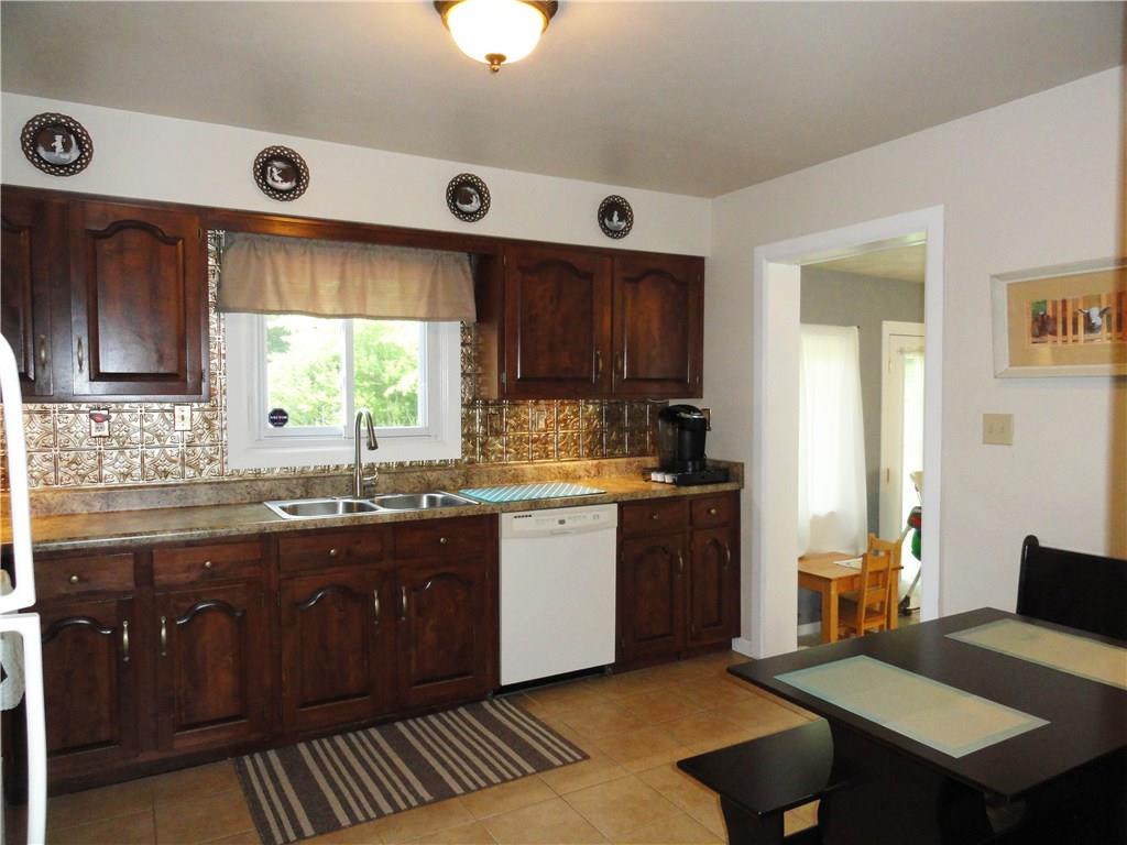 2339 Spicher Hill Road Irwin, PA 15642 - Photo 9 of 25 Spacious kitchen with wood cabinets, updated countertops, new faucet & a complete appliance package