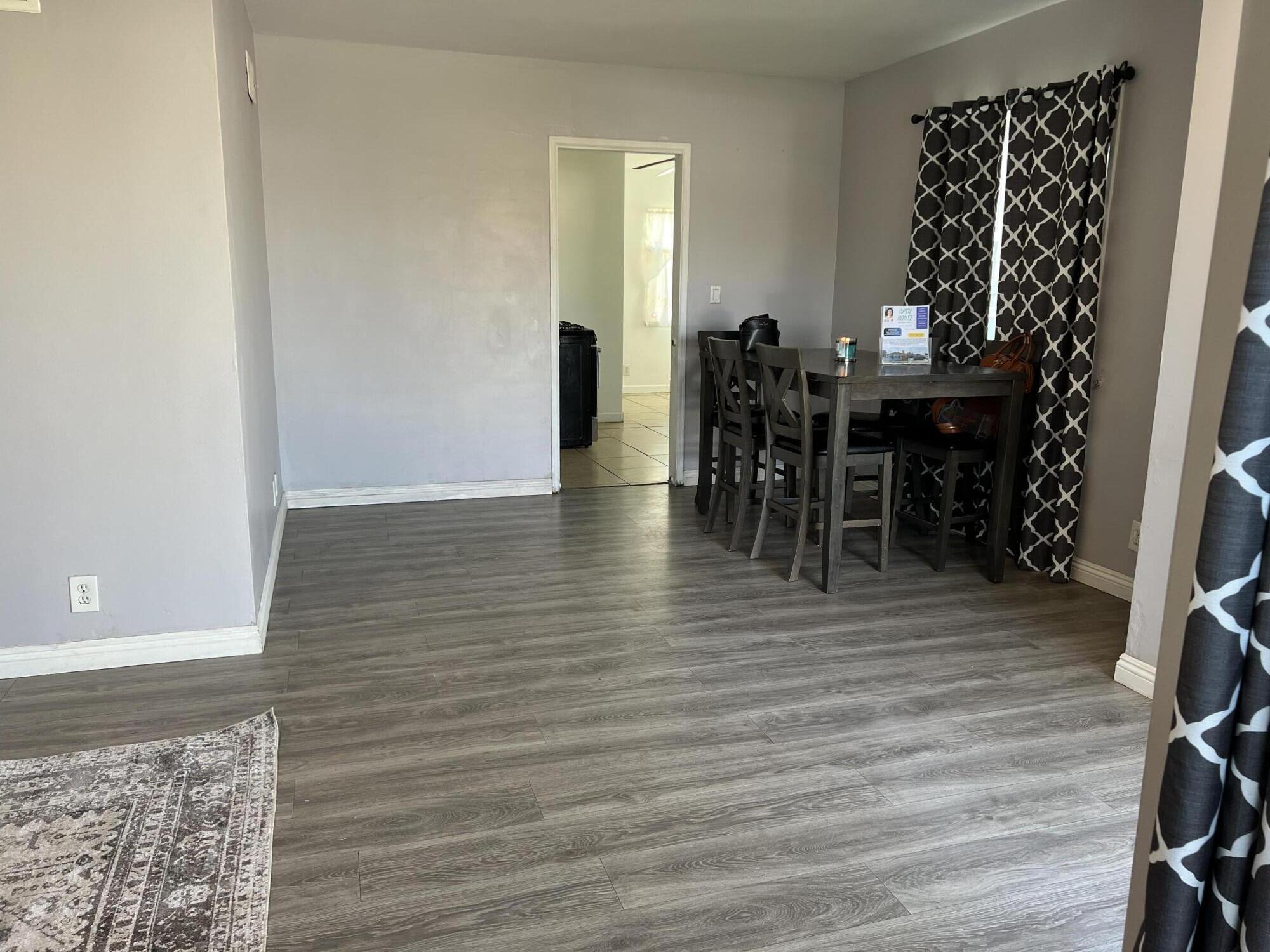 4916 Brompton Avenue Bell, CA 90201 - Photo 19 of 50 a view of a room with wooden floor