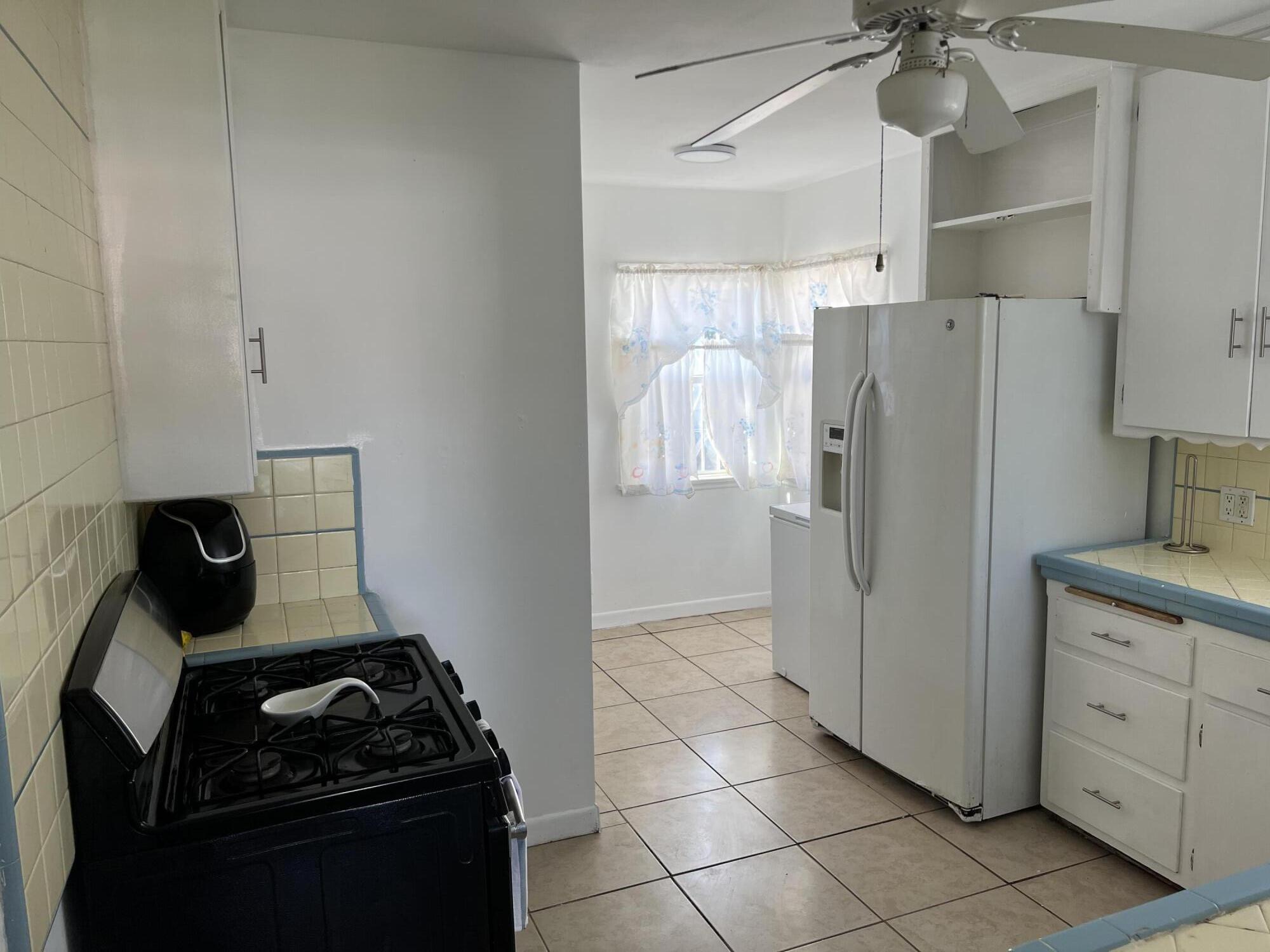 4916 Brompton Avenue Bell, CA 90201 - Photo 20 of 50 a kitchen with appliances and cabinets