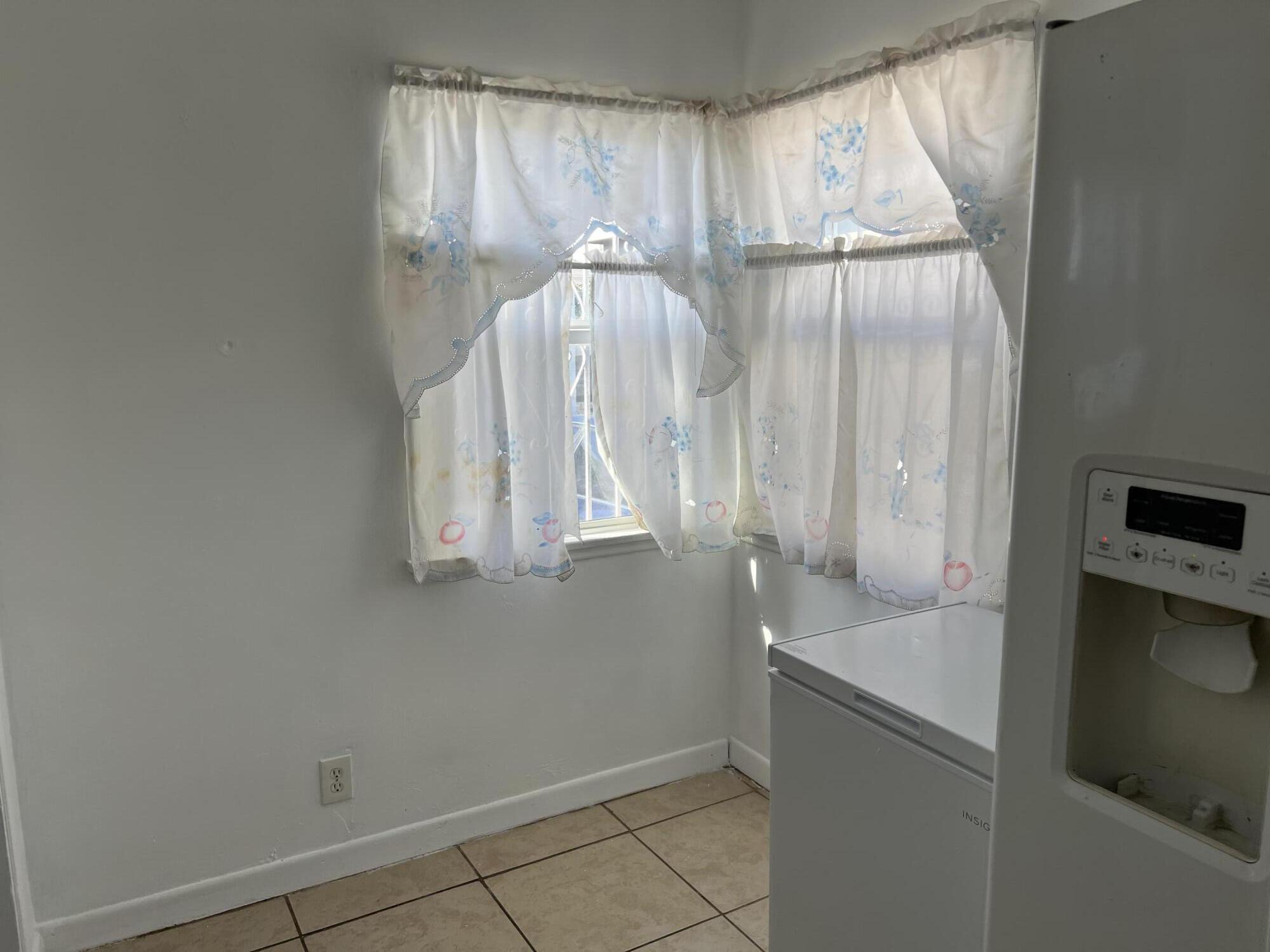 4916 Brompton Avenue Bell, CA 90201 - Photo 21 of 50 a bathroom with a bathtub and shower