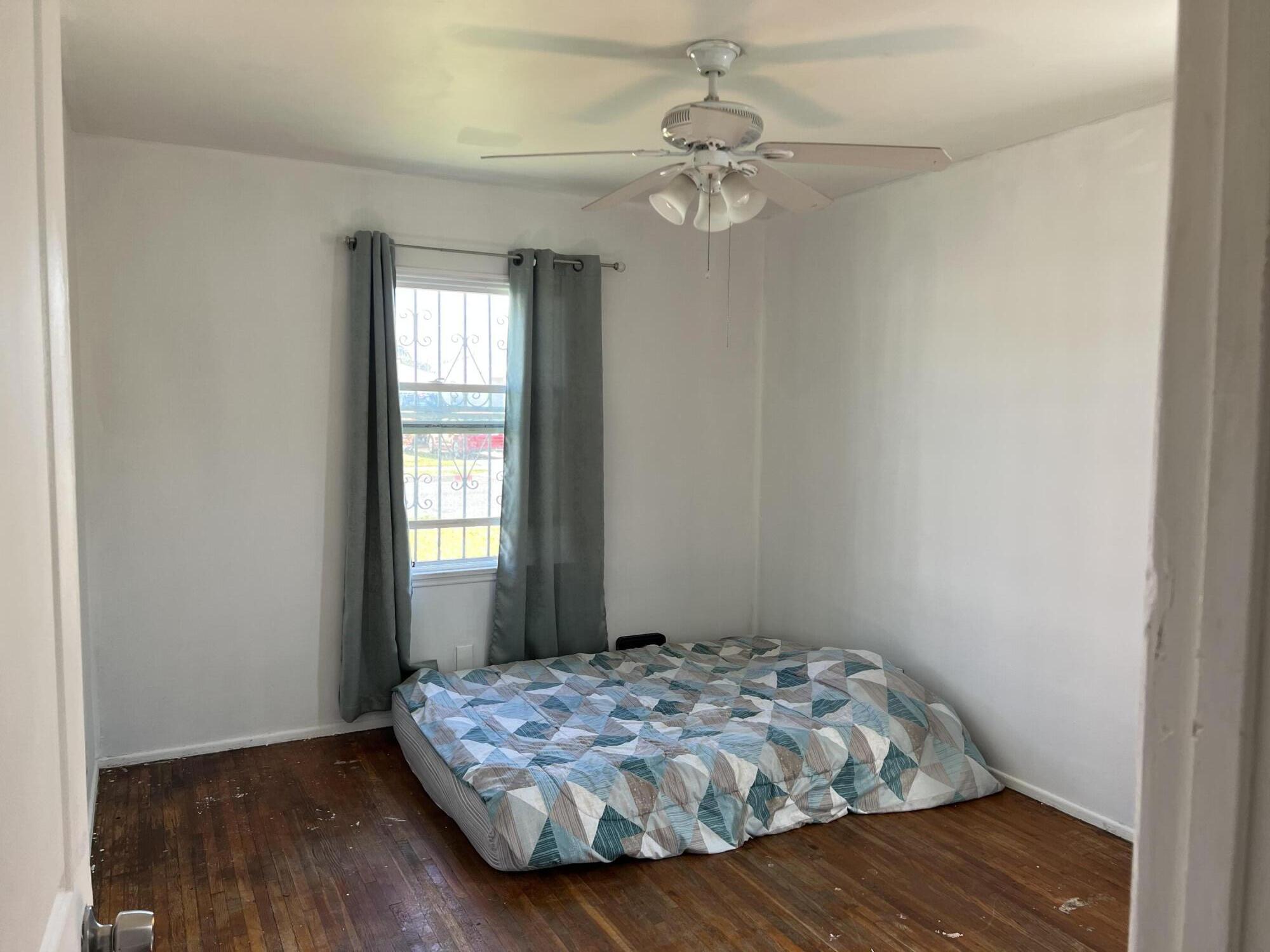 4916 Brompton Avenue Bell, CA 90201 - Photo 26 of 50 a bedroom with bed and window