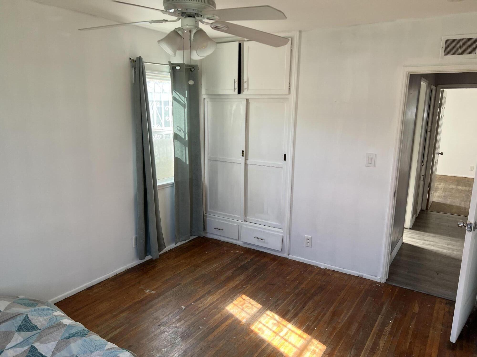 4916 Brompton Avenue Bell, CA 90201 - Photo 27 of 50 wooden floor in an empty room