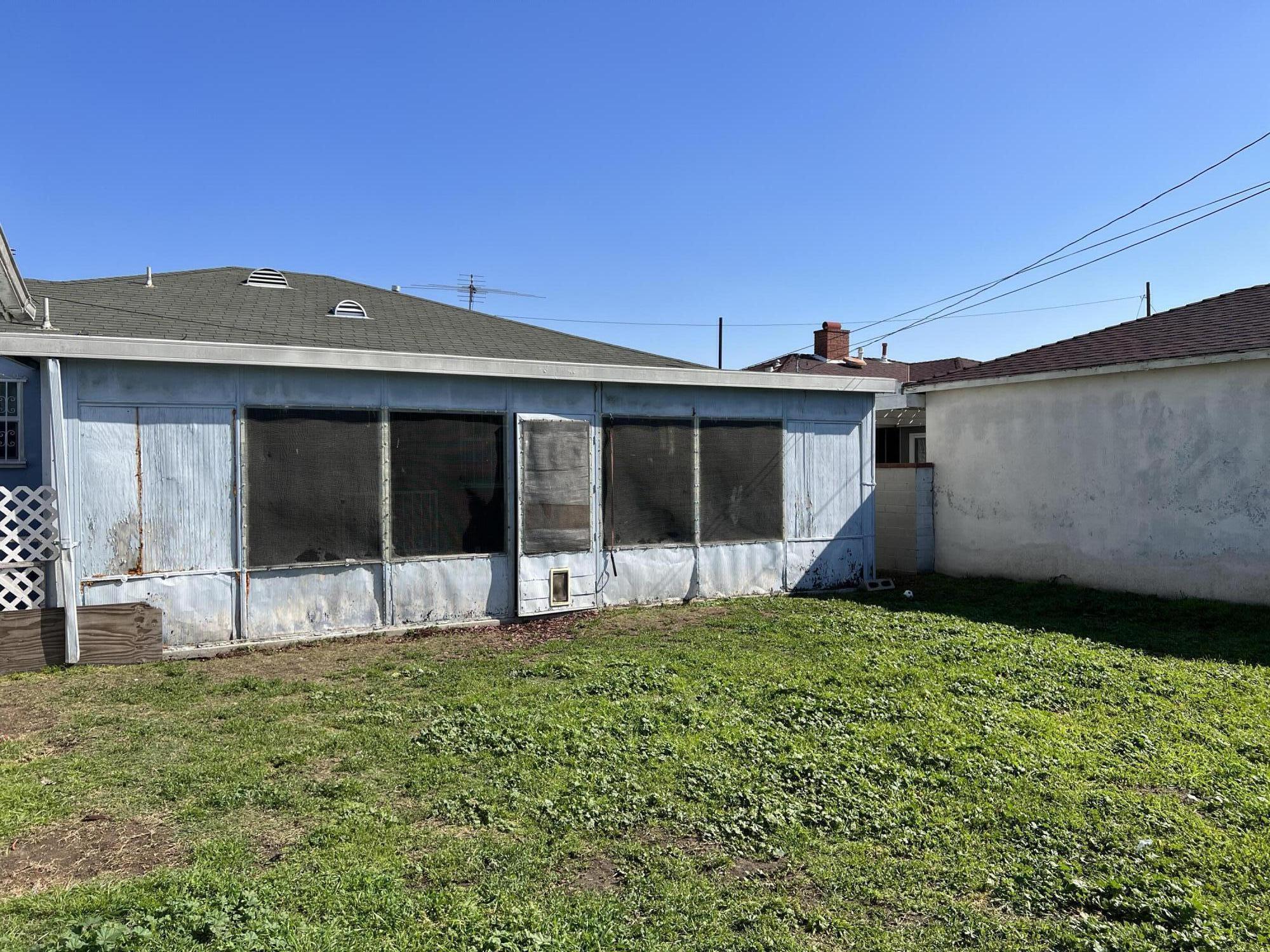 4916 Brompton Avenue Bell, CA 90201 - Photo 39 of 50 a view of a house with a yard