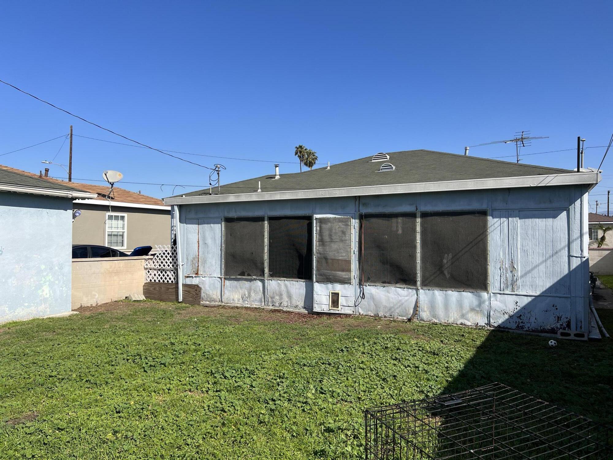 4916 Brompton Avenue Bell, CA 90201 - Photo 40 of 50 a view of a house with a yard and sitting area