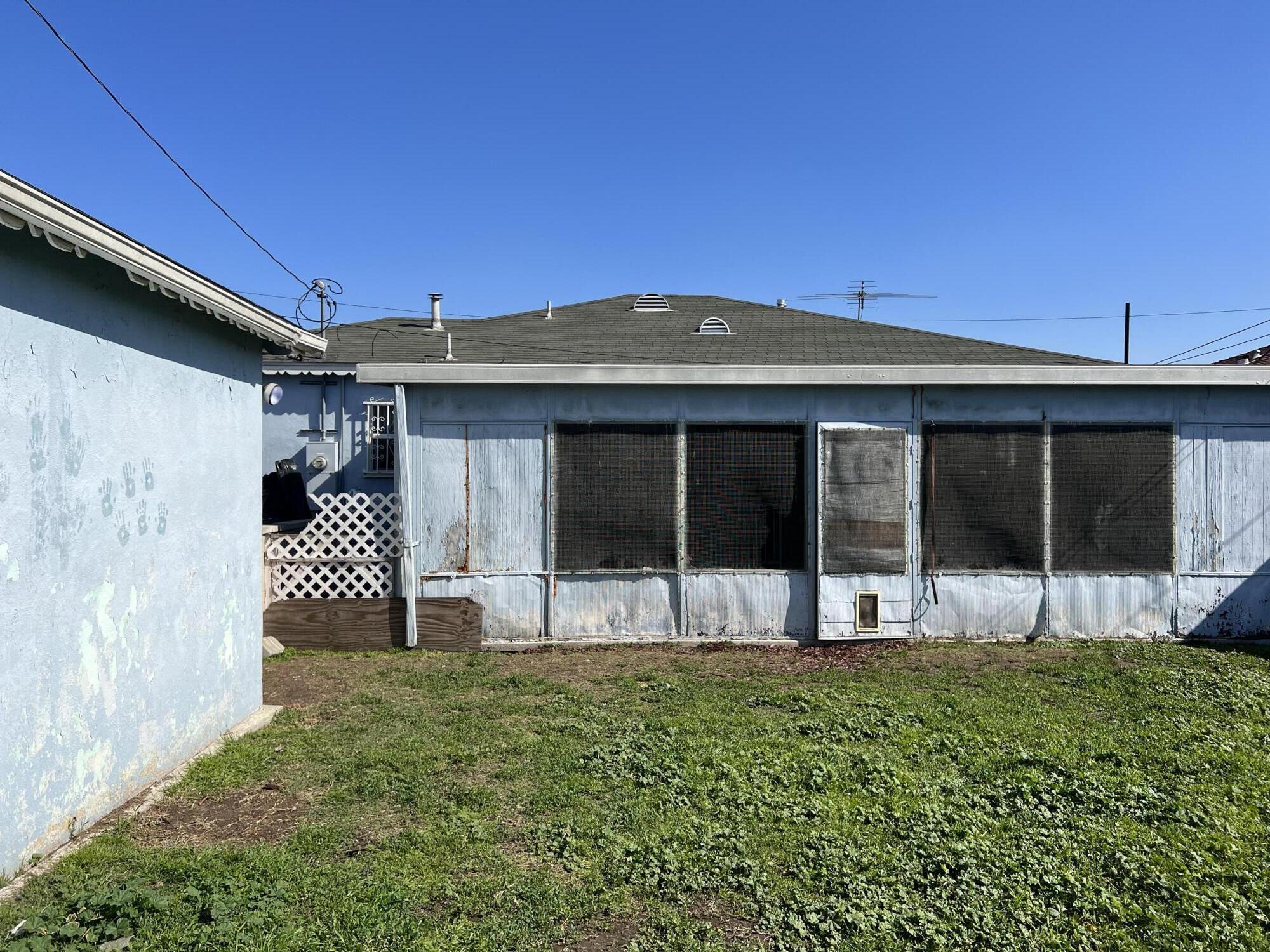 4916 Brompton Avenue Bell, CA 90201 - Photo 42 of 50 a front view of a house with a yard