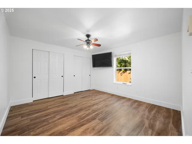 a bathroom with a sink toilet a mirror and shower
