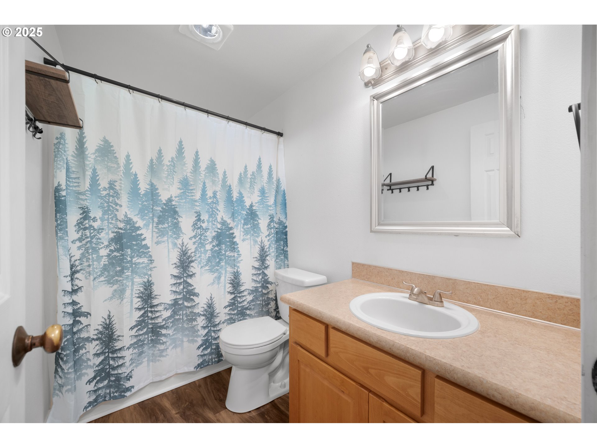 1407 Southwest 6th Avenue Battle Ground, WA 98604 - Photo 14 of 35 a bathroom with a sink toilet a mirror and shower