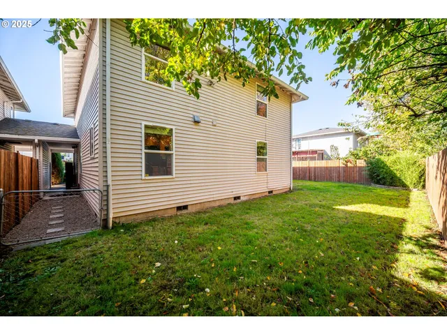a view of a back yard with a house