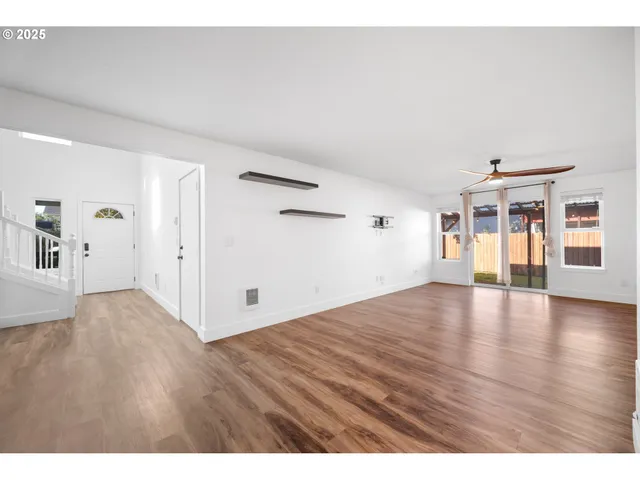 a view of an empty room with glass door