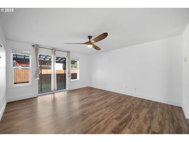 a view of an empty room with a flat screen tv