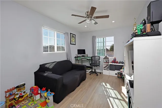 a bathroom with a granite countertop sink a toilet and a mirror